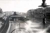 Pollokshields station (east). Pickersgill 4.4.0 54465 on inner train.<br><br>[G H Robin collection by courtesy of the Mitchell Library, Glasgow 19/07/1949]