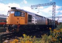 26034, tool van and crane take the dive under to join the Burma Road at Shields Junction No 1. Shields Depot behind.<br><br>[Ewan Crawford //1987]
