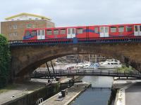 <h4><a href='/locations/L/Limehouse'>Limehouse</a></h4><p><small><a href='/companies/B/Blackwall_Railway'>Blackwall Railway</a></small></p><p>Unidentified DLR unit heading east along Limehouse Viaduct between Limehouse and Westferry stations, crossing the start of the Regent's Canal with Limehouse Basin, formerly known as Regent's Canal Dock, beyond on 7th June 2008. The viaduct was opened by the London & Blackwall Railway in 1840 but closed to passengers in 1926 and to freight in 1962. It lay disused until 1987 when it was utilised by one of the first two sections of the DLR. It is now a Grade 1 Listed Structure by English Heritage. The year 2020 also marks the bi-centenary of the Regent's Canal that opened in 1820 to link the Grand Junction Canal at Paddington with the Thames at Limehouse. Both canals were amalgamated in 1929 to form the Grand Union Canal but the Regent's Canal is still known colloquially by its original name. 1/46</p><p>07/06/2008<br><small><a href='/contributors/David_Bosher'>David Bosher</a></small></p>