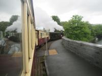 <h4><a href='/locations/P/Porthmadog_Harbour_WHR'>Porthmadog Harbour [WHR]</a></h4><p><small><a href='/companies/F/Festiniog_to_Welsh_Highland_Link'>Festiniog to Welsh Highland Link</a></small></p><p>Welsh Highland Railway train to Caernarfon, behind ex-South African Railways NSGG Garrett Class 16 2-6-2+2-6-2 No.87, just departed from Porthmadog Harbour and beginning its long and spectacular journey up into Snowdonia, on 22nd May 2016. This was the final section of the Welsh Highland Railway to be reopened in 2011 after having lain derelict since 1937, a remarkable achievement. 3/10</p><p>22/05/2016<br><small><a href='/contributors/David_Bosher'>David Bosher</a></small></p>