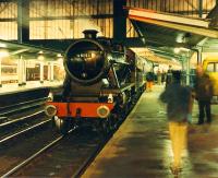 <h4><a href='/locations/C/Carlisle'>Carlisle</a></h4><p><small><a href='/companies/C/Caledonian_Railway'>Caledonian Railway</a></small></p><p>How unusual, a steam engine off the S&C at Carlisle! 48151 draws little attention as it grows dark. 18/28</p><p>26/11/1988<br><small><a href='/contributors/Ewan_Crawford'>Ewan Crawford</a></small></p>