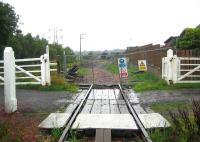 Looking over the level crossing at the north end of Kincardine station 0n 19 April 2006, following removal of the old track back towards Alloa.<br><br>[John Furnevel 19/04/2006]