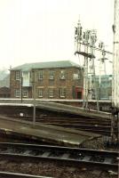 View looking east across the platform ends showing the semaphore signals and Stirling goods office.<br><br>[Ewan Crawford //]