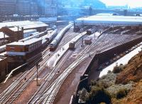 View over the east end of Waverley in October 1978, with a class 47 taking a train out of 'sub' platform 21 past the goods depot. The old Waverley East signal box is on the left with the corner of New Street bus depot opposite. The 1977 signaling Centre is in the left background beyond the train.<br><br>[John Furnevel 07/10/1978]
