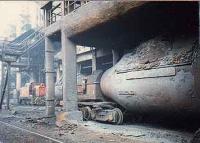Torpedos and industrial locomotives at bottom of a blast furnace at the Ravenscraig Steelworks<br><br>[Ewan Crawford //]