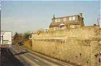 Looking east at the former Friockheim station where the railway crossed the roadway on an overbridge.<br><br>[Ewan Crawford //]