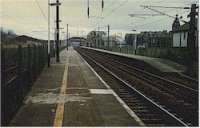 Looking south at Lockerbie station, far north end of station. The line to Dumfries and Lochmaben formerly branched off the right here.<br><br>[Ewan Crawford //]