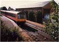 Looking west at East Kilbride station. Goods shed and goods yard now cleared and flats built. Class 101 dmu in station.<br><br>[Ewan Crawford //]