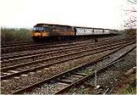 View looking east at Greenhill Upper Junction, class 47 with passenger train passing.<br><br>[Ewan Crawford //]