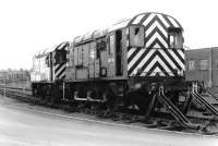 08718 (ex-D3886) (nearest) and 08586 (ex-D3753) stand out of use awaiting disposal on the north side of Ayr shed yard on 25 February 1998. The locomotives, which had ended their operational lives at Fort William and Upperby carriage depot respectively, were eventually cut up here by European Metal Recycling in May 2000.<br><br>[John Furnevel 25/02/1998]