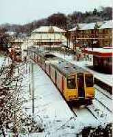 Looking east at Hillfoot station in snow. Class 314 in station.<br><br>[Ewan Crawford //]