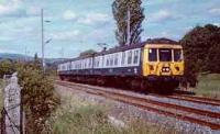 View looking north at Burnbrae. Line when still double track and class 303 heading south.<br><br>[Ewan Crawford //]