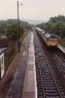 Class 47 hauled passenger train heading north through Carrbridge station.<br><br>[Ewan Crawford //]