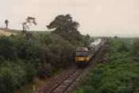 Class 47 hauled passenger train heads east at the former Gollanfield Junction station.<br><br>[Ewan Crawford //]
