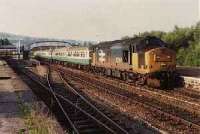 Looking north at Dingwall station, class 37 hauled passenger train heading south.<br><br>[Ewan Crawford //]