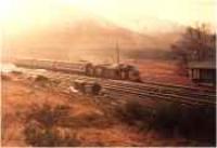 Class 37 hauled passenger train heading north through Bridge of Orchy station.<br><br>[Ewan Crawford //]