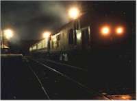 Class 37 hauled passenger train heading north through Tulloch station at night.<br><br>[Ewan Crawford //]