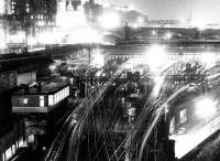 Waverley at night in October 1972. Nightshifts are at work in Waverley East signal box and New Street bus depot, while the old elevated walkway, linking Jeffrey Street and Calton Road, can be clearly seen.<br><br>[John Furnevel 10/10/1972]