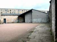 Interior of the former North Leith terminus in June 2002 looking towards the buffer stops. The warehousing in the background stands on the north side of Commercial Street. [See image 1070]<br><br>[John Furnevel 23/06/2002]