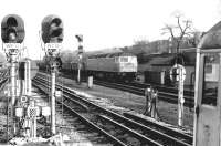 47241 about to run through Ealing Broadway with a westbound freight in April 1981 about to pass a tube train standing at the LT Central Line platforms.<br><br>[John Furnevel 29/04/1981]