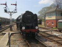 <h4><a href='/locations/H/Horsted_Keynes'>Horsted Keynes</a></h4><p><small><a href='/companies/E/East_Grinstead_to_Culver_Junction_London,_Brighton_and_South_Coast_Railway'>East Grinstead to Culver Junction (London, Brighton and South Coast Railway)</a></small></p><p>British Railways Standard Class 9F no. 92212 arriving at Horsted Keynes station with a Bluebell Railway service from Sheffield Park to East Grinstead, on Bank Holiday Monday, 6th May 2013.   This was one of the last 9Fs to be built at the ex-GWR's Swindon works and came off the production line in September 1959.   After a stint on the much lamented Somerset & Dorset Line and lines in Wales, it was withdrawn from service after less than 10 years in January 1968 and found its way to Woodham's scrapyard at Barry.   Eventually rescued for preservation, it was not until the early 21st Century that an extensive two years overhaul was taken with the locomotive returning to steam on 11th September 2009.   It is now based at the Mid-Hants Railway. 2/23</p><p>06/05/2013<br><small><a href='/contributors/David_Bosher'>David Bosher</a></small></p>