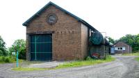 Part of the former goods yard at Newburgh in June 2005, where several old railway buildings have been put to good use since closure. The former station building is off picture to the right. The white sign in the left background stands alongside the A913 Abernethy Road and reads 'Wecome to Newburgh - Drive Safely'.<br><br>[John Furnevel 21/06/2005]