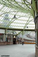 View from the ends of platforms 3 and 4 looking through the circulating area to the glazed pier walkway. The stations clock tower can be viewed through the glazed roof to the left.<br><br>[Ewan Crawford 4/6/2004]