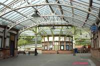 The circulating area as viewed from the curved walkway to the pier. Platforms 1 and 2 are to the right beyond the circulating area and the disused platforms 3 and 4 are to the right. Variations of this view are very popular for postcards of this station.<br><br>[Ewan Crawford 4/6/2004]