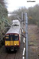 To the north of the station the line passes under a road bridge. To the right of the train was the former turntable and locomotive shed here.<br><br>[Ewan Crawford 4/6/2004]