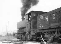 Shunting empties, No 10 in the Cutler Sidings alongside a snow covered Dunaskin Washery, Waterside, in December 1971.<br><br>[John Furnevel 01/12/1971]