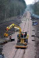 View looking south at Ferniegair showing the new passing loop. The crane is loading sleepers for delivery to Merryton.<br><br>[Ewan Crawford 20/03/2005]