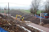 Small rail mounted crane delivers sleepers to the present end of the Larkhall Branch at Merryton. Truck on right is delivering hardcore for embankment stabilisation.<br><br>[Ewan Crawford 20/03/2005]