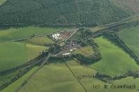 Aerial view of Merryton Junction. The view looks west. At the bottom left the original (lower) and Mid Lanark Lines (slightly higher) routes can be seen diverging.<br><br>[Ewan Crawford 1/7/2004]