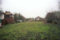 Norham station, looking east. Signalbox to left, station centre left and goods yard right.<br><br>[Ewan Crawford //]