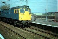 A class 27 passes east through Paisley St James. This was running light having probably taken empty molasses tanks to the James Watt dock in Greenock.<br><br>[Ewan Crawford //]