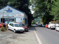 Not far from Brampton Town is the Railhead Garage, seen here in July 2006. Note the surviving bridge abutments beyond.<br><br>[Ewan Crawford 03/07/2006]