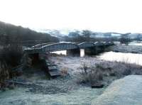 Approaching Christmas 2003 with frost and snow covering much of the countryside, including the old railway bridge over the Tweed north of Cardrona station.<br><br>[John Furnevel 13/12/2003]