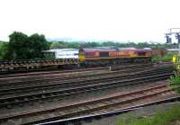 EWS 66066 with a PW train standing opposite Haymarket MPD on a Sunday morning in June 2006. View south across the running lines towards the Pentland Hills.<br><br>[John Furnevel 04/06/2006]