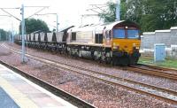 Coal empties pull up in Carstairs station to allow passage of the Glasgow sleeper - 11 July 2006. <br><br>[John Furnevel /07/2006]