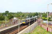 A Cumbernauld - Glasgow Queen Street train leaving Stepps station in July 2006.<br><br>[John Furnevel 26/07/2006]