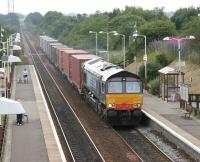 12.56 Elderslie - Grangemouth container train passing through Greenfaulds in July 2006.<br><br>[John Furnevel 26/07/2006]