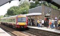 Arrival at Lenzie in July 2006, looking west towards Glasgow Queen Street.<br><br>[John Furnevel 26/07/2006]