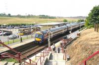 An Edinburgh Waverley - Glasgow Queen Street service calls at the busy Croy station in July 2006. The bus interchange connects with various surrounding towns including Cumbernauld and Kilsyth.<br><br>[John Furnevel 26/07/2006]