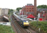 GNER Kings Cross - Glasgow Central service passing the renowned Caledonian Brewery (1869) in Slateford Road, Edinburgh, shortly after leaving Haymarket East Junction on 27 July 2006.<br><br>[John Furnevel 27/07/2006]