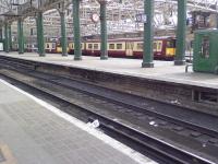 Class 314s stabled at Platforms 8 & 9 as a result of track renewal work at Glasgow Central.<br><br>[Graham Morgan 23/04/2006]