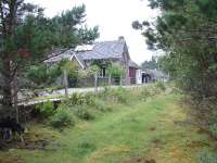 A view of Dava Station looking north.The station house,waiting shelter and railway cottages still remain.July 2006.<br><br>[John Gray /07/2006]