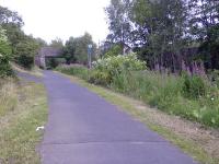 Looking East, this shows the site of Houston and Crosslee Station. Platform 2 is still in place, as is the station house which is now a private dwelling.<br><br>[Graham Morgan 12/07/2006]