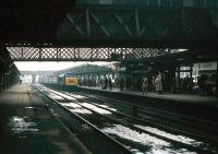 A late running Derby - St Pancras train arriving at Leicester Midland on a cold and miserable 11 February 1979, with the usual 'Peak' in charge.<br><br>[John Furnevel 11/02/1979]