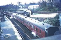 Morning train for St Enoch calls at Thornliebank in last week of steam.<br><br>[John Robin /04/1966]