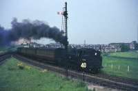 Driver of 80116 smokes his pipe at Busby Jct en route to East Kilbride.<br><br>[John Robin 29/05/1964]